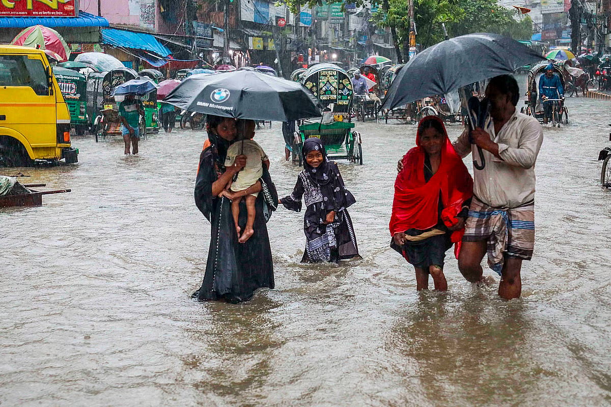 Torrential rainfall has left the Reazuddin Bazar area of Chattogram city submerged in knee-deep water. Despite the severe waterlogging, residents have been forced to navigate the floods to attend to urgent matters. The photo was taken in 7 July 2026