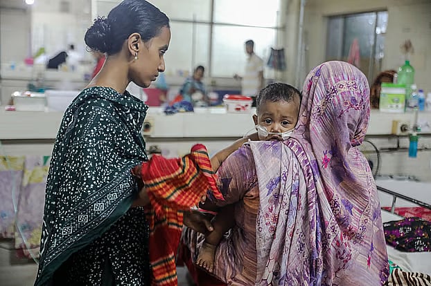 A child receives treatment for measles at Bangladesh Shishu Hospital and Institute in Dhaka on Wednesday.