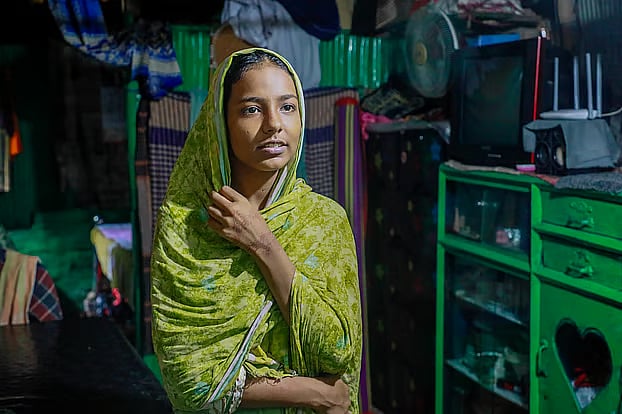 Bibi Kulsum Akter recalls the landslide that claimed the lives of her father and younger sister. The photo was taken at the IW Colony in Chattogram's Sholoshahar on Wednesday. 