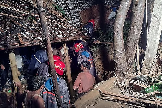 Fire Service personnel conduct rescue operations following a landslide in Ukhiya, Cox's Bazar, early Monday.