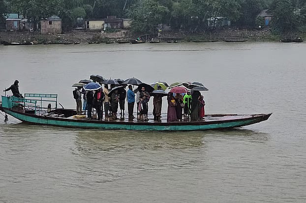 Water levels rise in rivers and haors due to rain and upstream inflows. Launch terminal, Sunamganj,9 July.