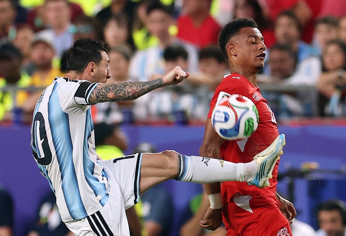 Argentina's Lionel Messi in action with Switzerland's Dan Ndoye at FIFA World Cup 2026 - Quarter Final - Argentina v Switzerland - Kansas City Stadium, Kansas City, Missouri, US - 11 July, 2026.