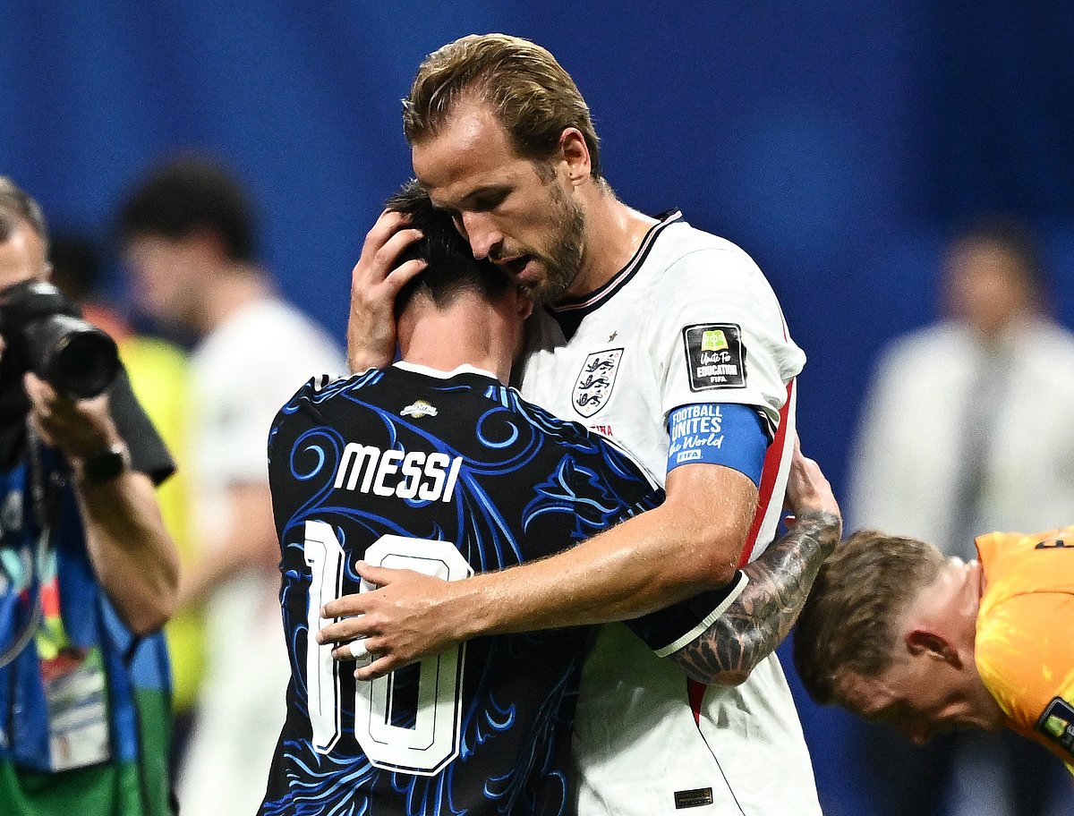 Argentina's Lionel Messi hugs England's Harry Kane at the end of the match