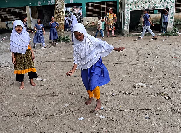 Students enjoy a game before classes begin at Gouripur Pashim Government Primary School. Daudkandi, Cumilla.