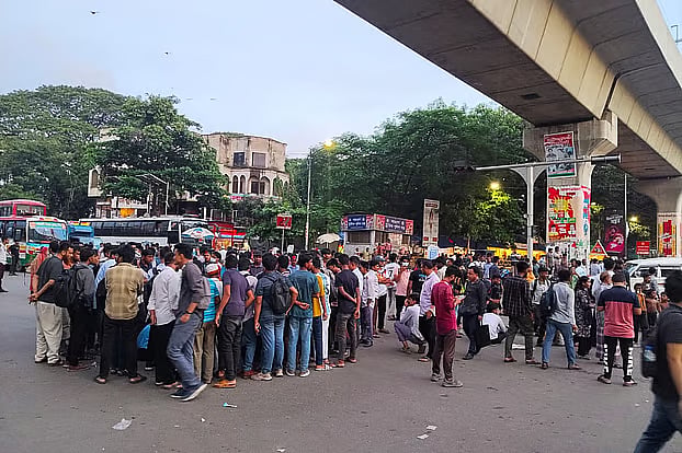 Students protesting for the Education Minister's resignation block Shahbagh intersection in Dhaka.