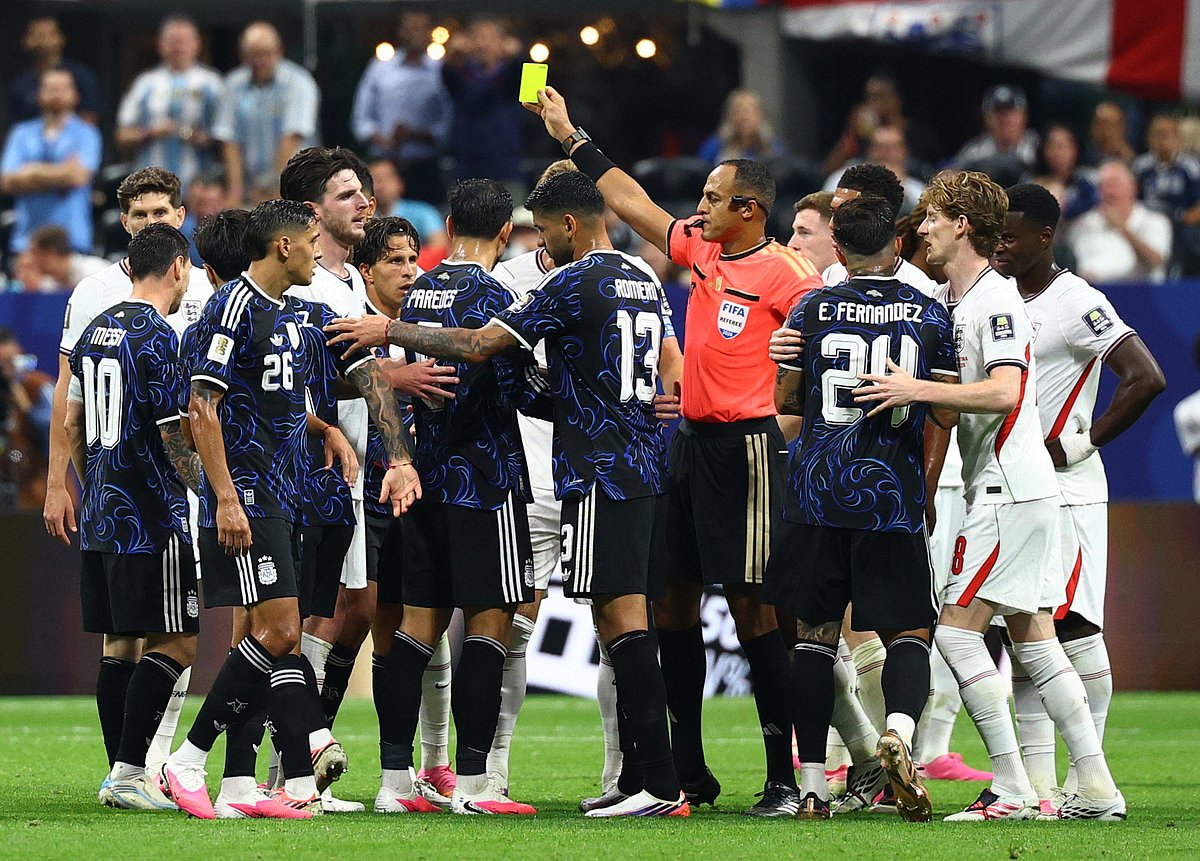 Soccer Football - FIFA World Cup 2026 - Semi Final - England v Argentina - Atlanta Stadium, Atlanta, Georgia, U.S. - July 15, 2026
Referee Ismail Elfath holds a yellow card after a challenge on Argentina's Lionel Messi from England's Elliot Anderson IMAGN IMAGES via Reuters/Nathan Ray Seebeck