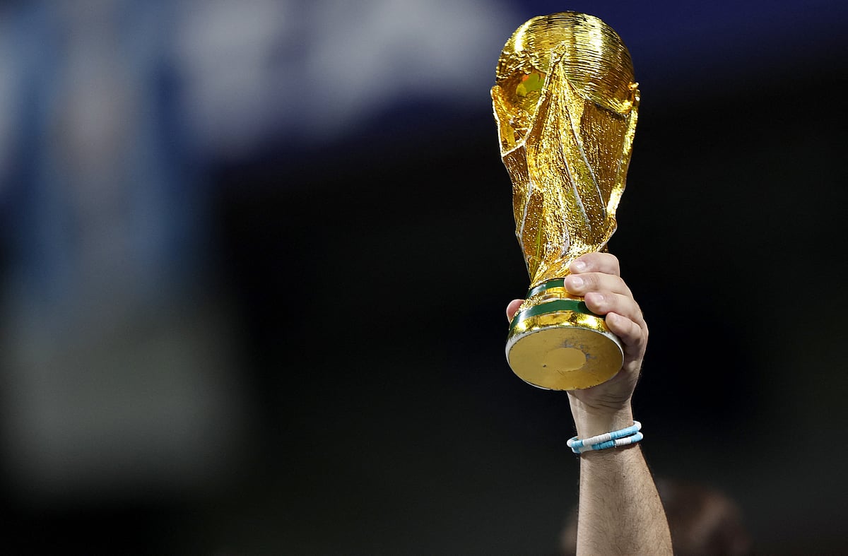 Soccer Football - FIFA World Cup 2026 - Semi Final - England v Argentina - Atlanta Stadium, Atlanta, Georgia, U.S. - July 15, 2026
Argentina fan displays a replica World Cup trophy inside the stadium before the match REUTERS/Amanda Perobelli
