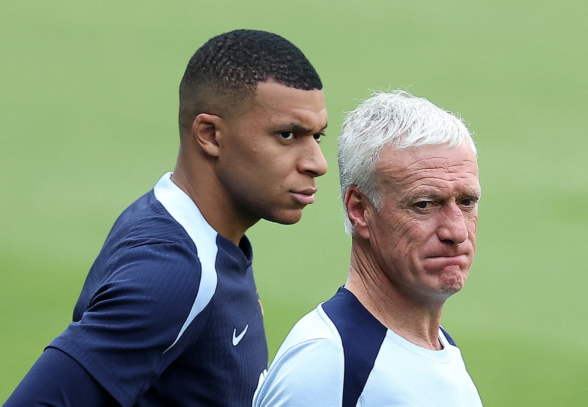 (FILES) France's head coach Didier Deschamps (R) and France's forward #10 Kylian Mbappe (L) look on during a training session at the Home Deluxe Arena Stadium in Paderborn, western Germany, on 27 June, 2024, during the UEFA EURO 2024 football competition.