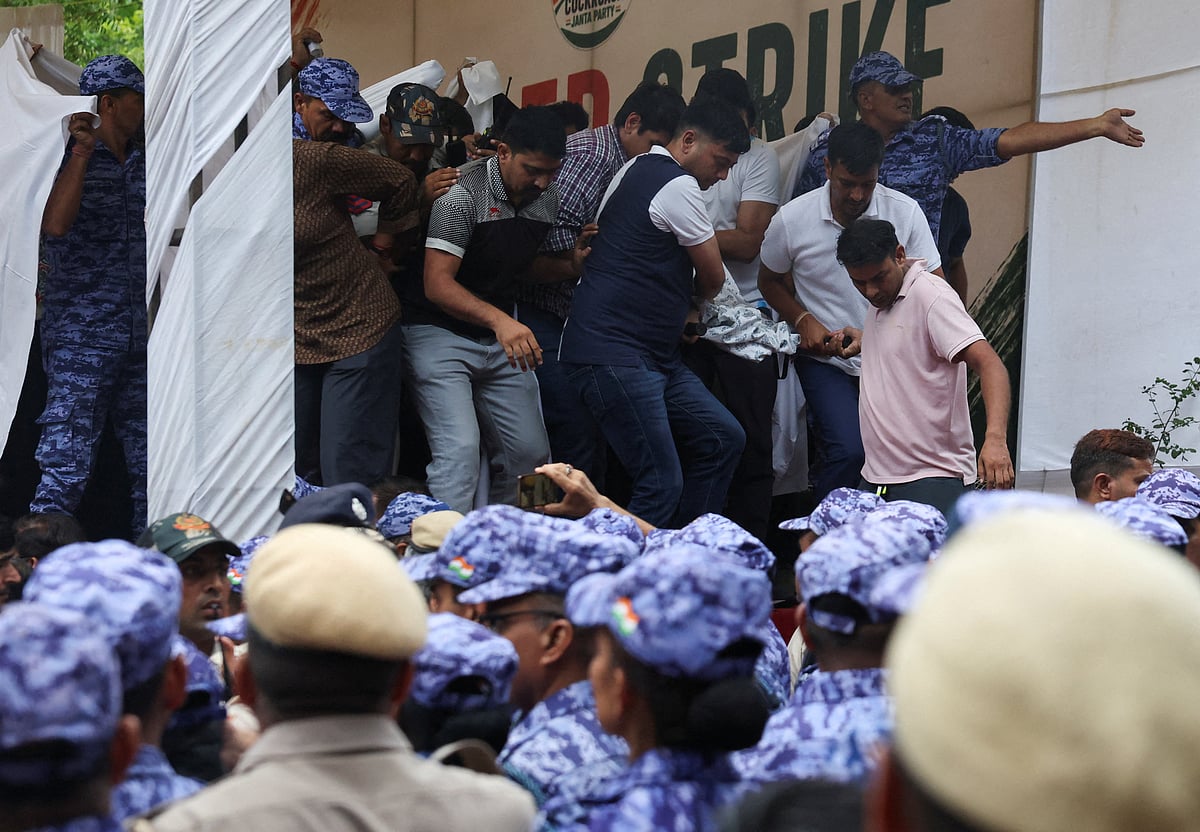 Authorities surround Sonam Wangchuk, an Indian education reformer, who has been on hunger strike, as they carry him on a stretcher while being taken to the hospital during a sit-in protest called by Cockroach Janta Party (CJP) demanding the resignation of Indian Education Minister Dharmendra Pradhan, at Jantar Mantar in New Delhi, India, 18 July, 2026.