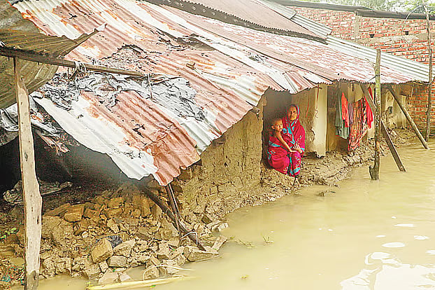 Rima Akter is worried after returning from a shelter to find her home damaged. Banshkhali, Chattogram on 11 July 2026.