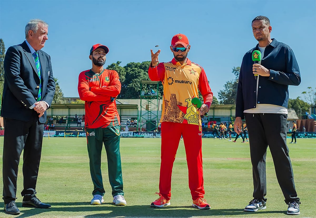 Zimbabwe captain Sikandar Raza flips the coin as Bangladesh skipper Towhid Hridoy watches before the start of third T20I match at Queens Sports Club in Bulawayo on 19 July 2026