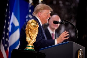 The FIFA World Cup 2026 winners trophy is visible as US President Donald Trump (C) speaks alongside FIFA President Gianni Infantino at a FIFA Reception at Trump Tower on July 17, 2026 in New York City.