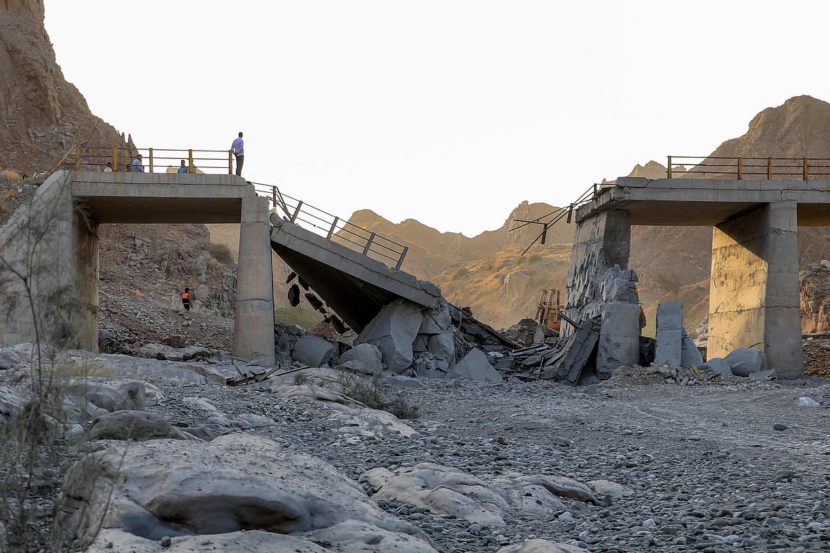 A heavily-damaged bridge which was hit by a US strike is pictured along the road connecting Roudan and Bandar Abbas in southern Iran on July 18, 2026. The United States hit Iran on July 17, with Tehran accusing US forces of striking civilians sites and drawing Iranian threats of reprisals on regional infrastructure. A battle over the strategic Strait of Hormuz has rekindled the war in the Middle East and the foes have traded fire for six days running.