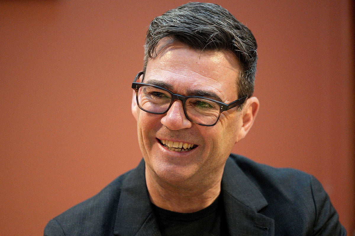 Labour Party leader Andy Burnham talks to staff during a visit to The Passage Homeless Charity in London early on 20 July 2026, just hours before taking the role as the country's new prime minister.