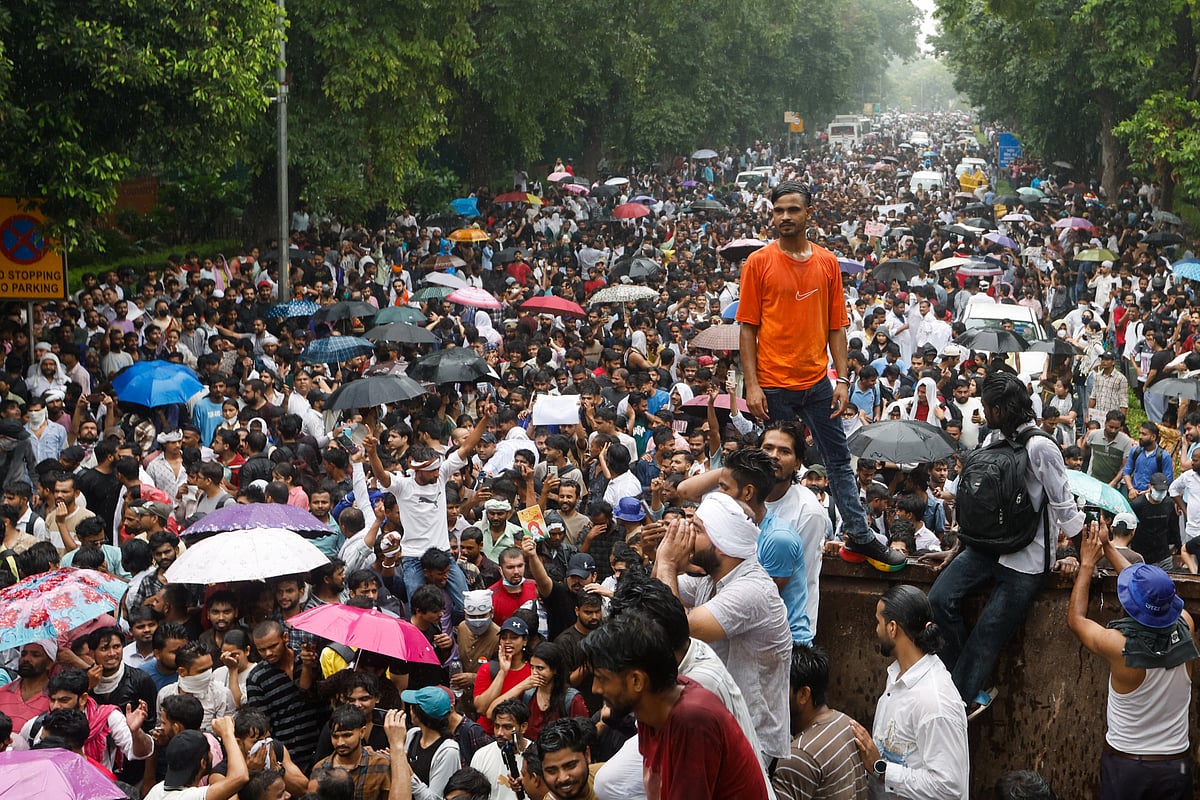Supporters of the Cockroach Janta Party gather as they march toward parliament on the opening day of its monsoon session, demanding the resignation of Education Minister Dharmendra Pradhan over exam paper leaks, in New Delhi, India, 20 July, 2026