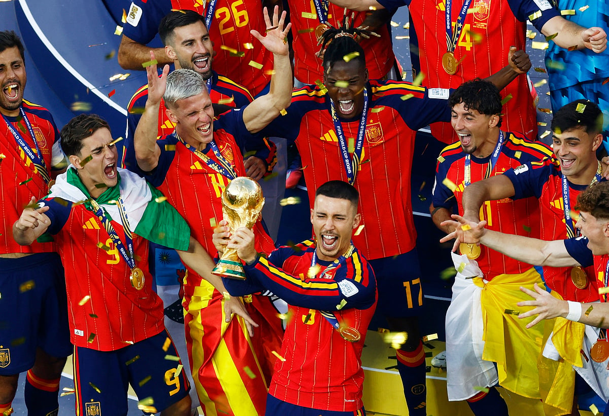 Spain's Alex Grimaldo lifts the World Cup trophy alongside teammates as they celebrate winning the World Cup at Soccer Football - FIFA World Cup 2026 - Final - Spain v Argentina - New York/New Jersey Stadium, East Rutherford, New Jersey, US - 19 July, 2026.