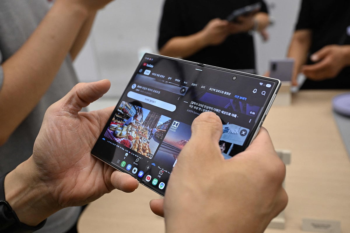 Customers try out newly-released Samsung Galaxy Z Fold8 smartphones at a Samsung store in Seoul on 23 July, 2026