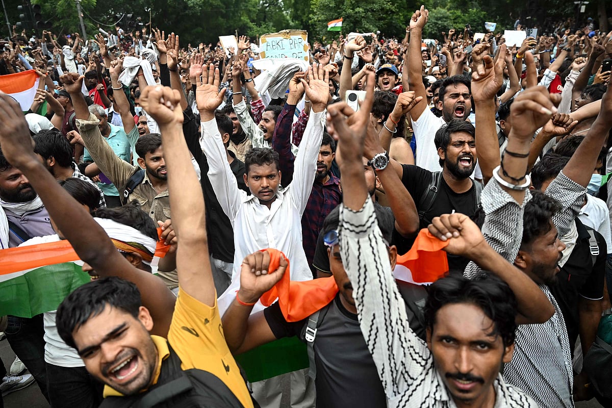 Cockroach Janta Party (CJP) supporters celebrate the resignation of India's Education Minister Dharmendra Pradhan, at Jantar Mantar in New Delhi on 25 July 2026 amid the ongoing protests over alleged NEET exam irregularities. India's education minister Dharmendra Pradhan resigned on 25 July 25, after mass youth-led protests demanded his ouster in anger over a string of irregularities in potentially life-changing exams.