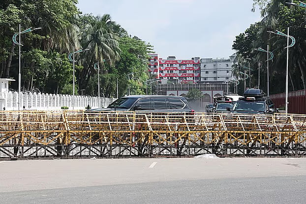 The former president's car is seen leaving Bangabhaban on Sunday afternoon.