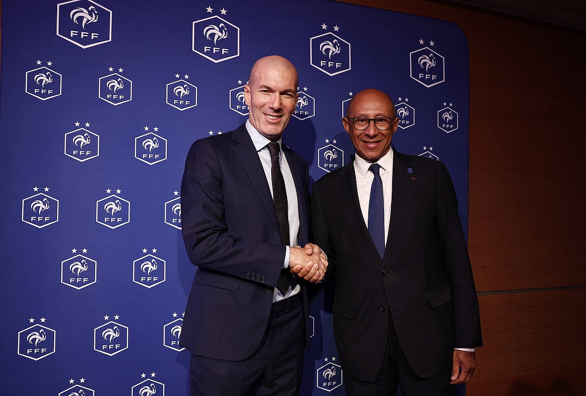 New head coach of France senior men's football team, Zinedine Zidane shakes hands with French Football Federation president Philippe Diallo