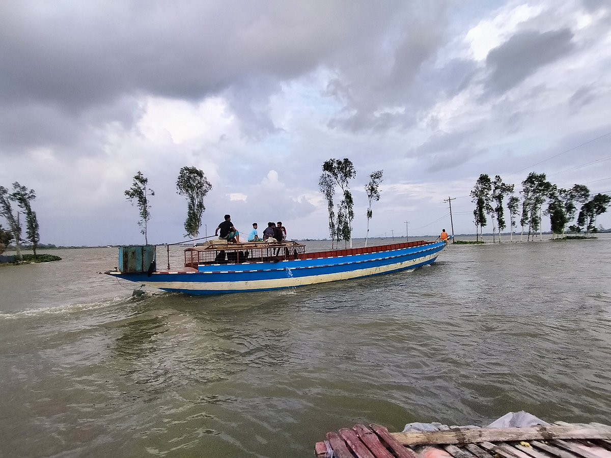 People of various ages are enjoying boat ride in the Chalan Beel. Kundoil, Sirajganj 29 July.