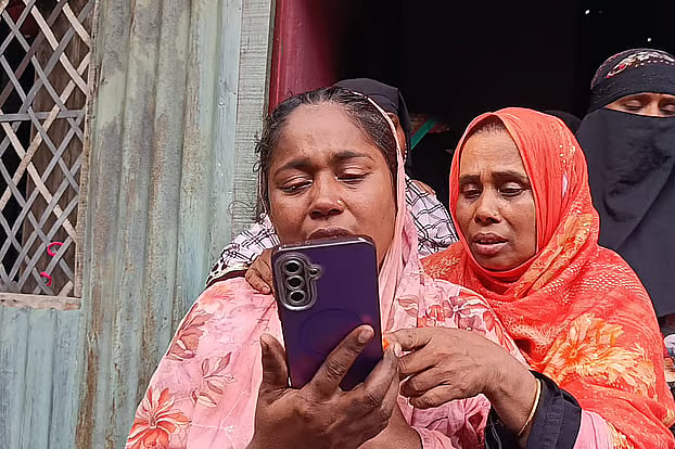 Relatives of Faisal, who died in a fire at a supershop in South Africa, mourn their loss.