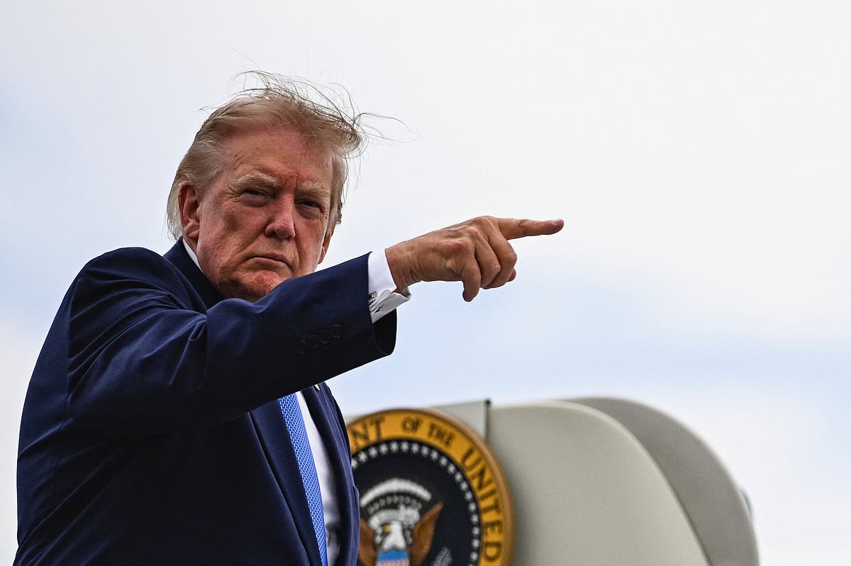 US President Donald Trump points a finger as he boards Air Force One at Morristown Municipal Airport in Morristown, New Jersey, US, 2 August, 2026.