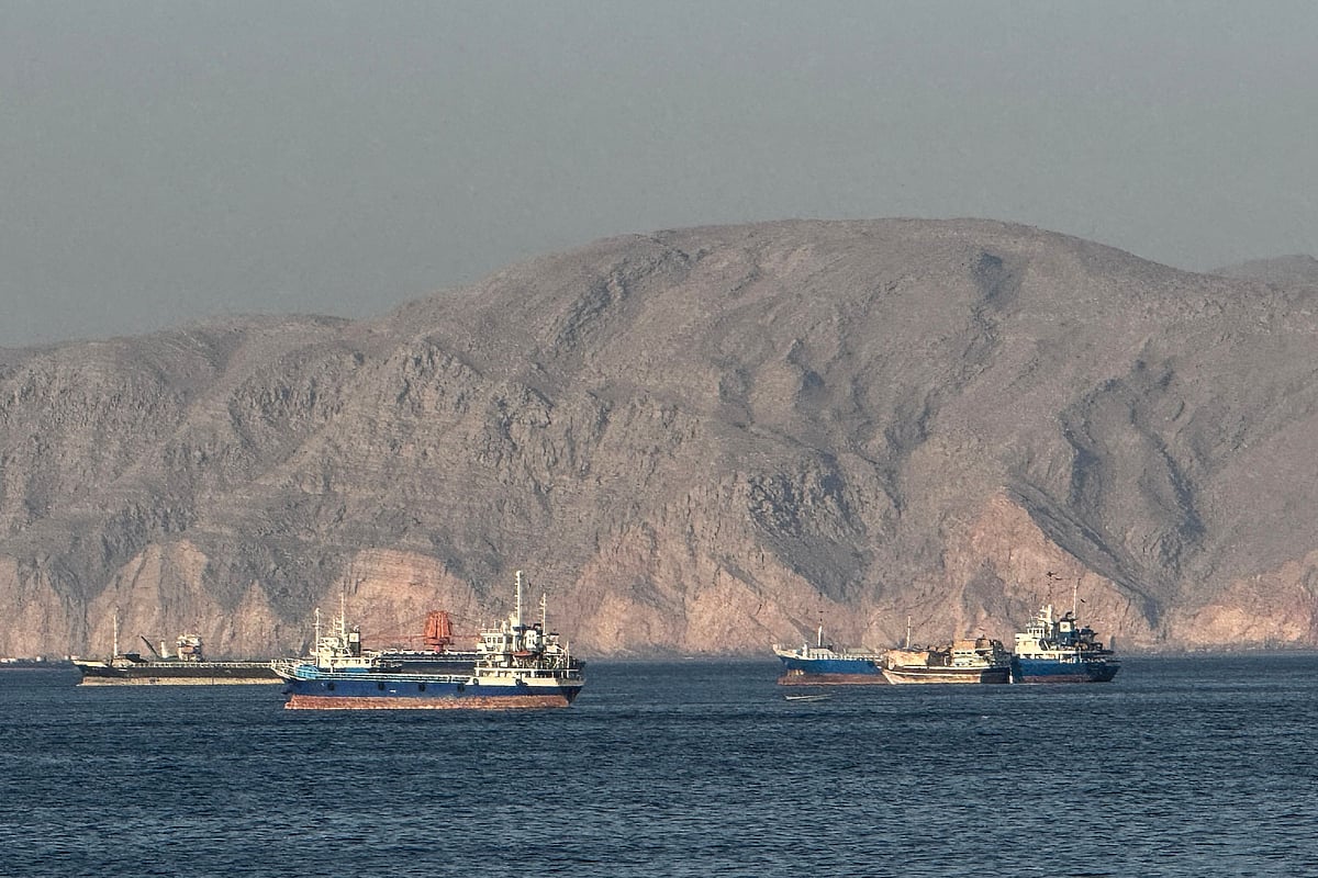 Vessels are seen anchored in the Strait of Hormuz, off the port city of Khasab on Oman's northern Musandam Peninsula on 17 May, 2026.
