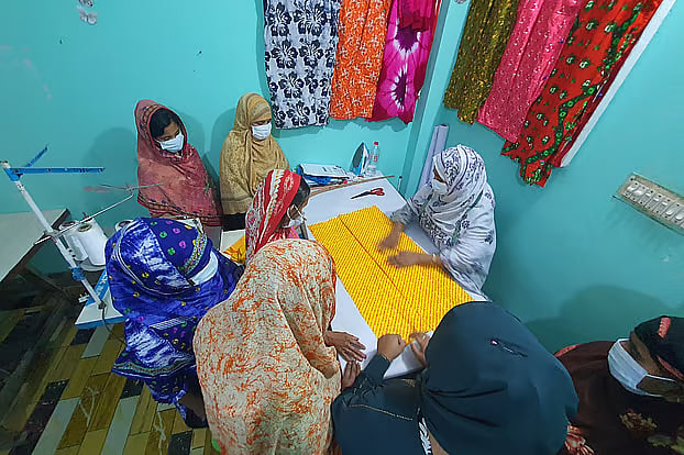 Floating sex workers are learning to sew, leaving behind their old profession to join the mainstream workforce.