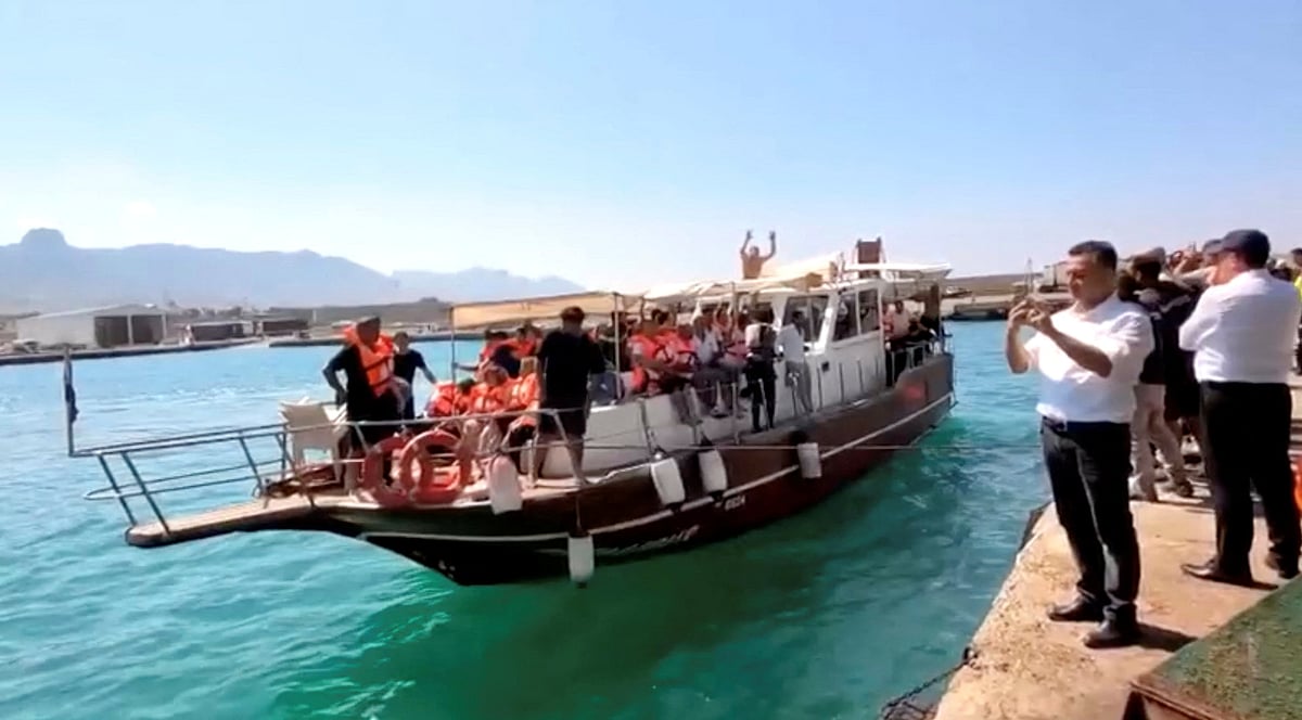 Survivors are taken to shore after boat capsizes, in Kyrenia, northern Cyprus, on 30 August 2026 in this screengrab taken from a video