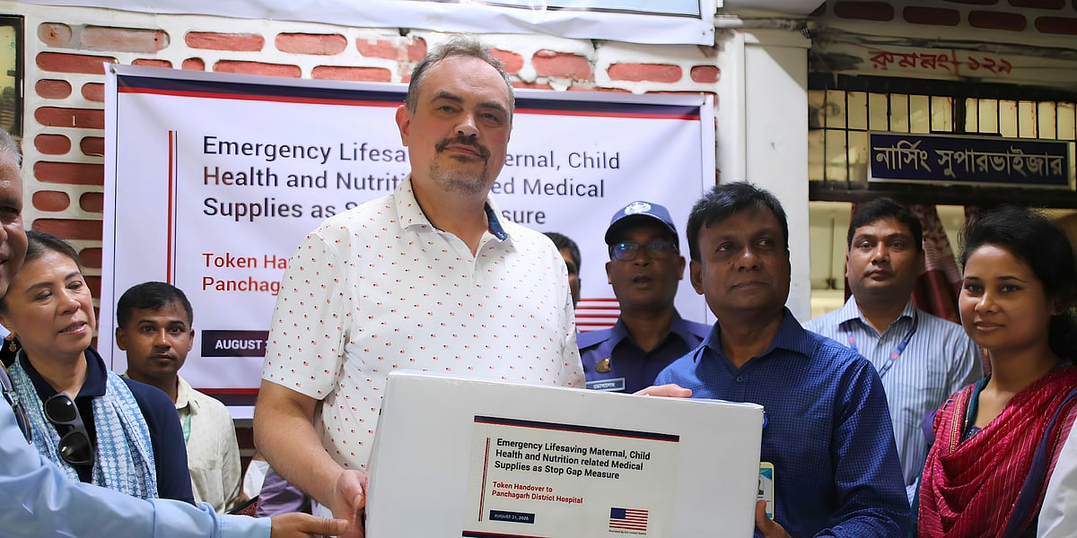 US Ambassador Brent T Christensen presents maternal and newborn care training models to Civil Surgeon Md Mizanur Rahman at Panchagarh District Hospital.