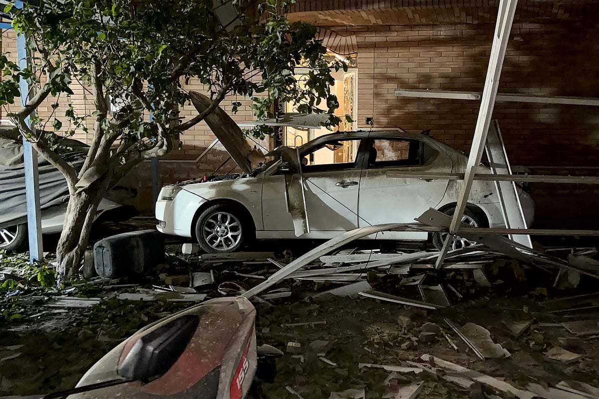 In this picture obtained by AFP from the Iranian news agency Tasnim on September 2, 2026 a destroyed vehicle is pictured at the site of an overnight strike in Kuhestak, Sirik County, in Iran's southern Hormozgan province on September 2, 2026. Iranian forces said on September 2 that they launched attacks on US military targets in the United Arab Emirates, Kuwait, Bahrain and other countries in the region, vowing "severe" consequences for renewed American attacks on the Islamic republic. (Photo by Masoud Mohamadi / TASNIM NEWS / AFP) /