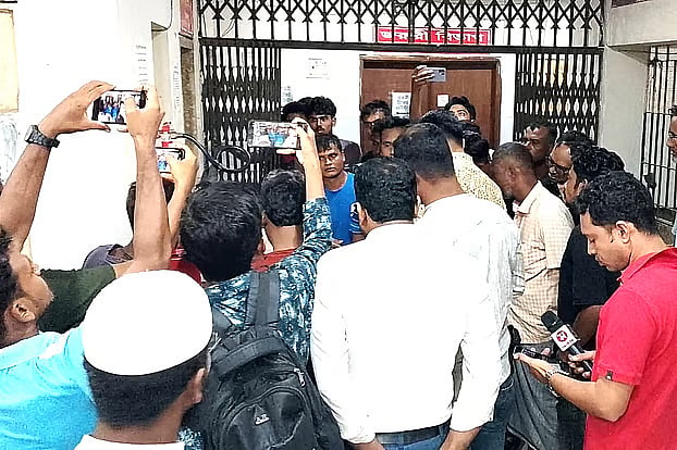 Relatives and local residents gather around the body of homeopath Anwarul Islam after he was declared dead at Natore Sadar Hospital on 3 September 2026.