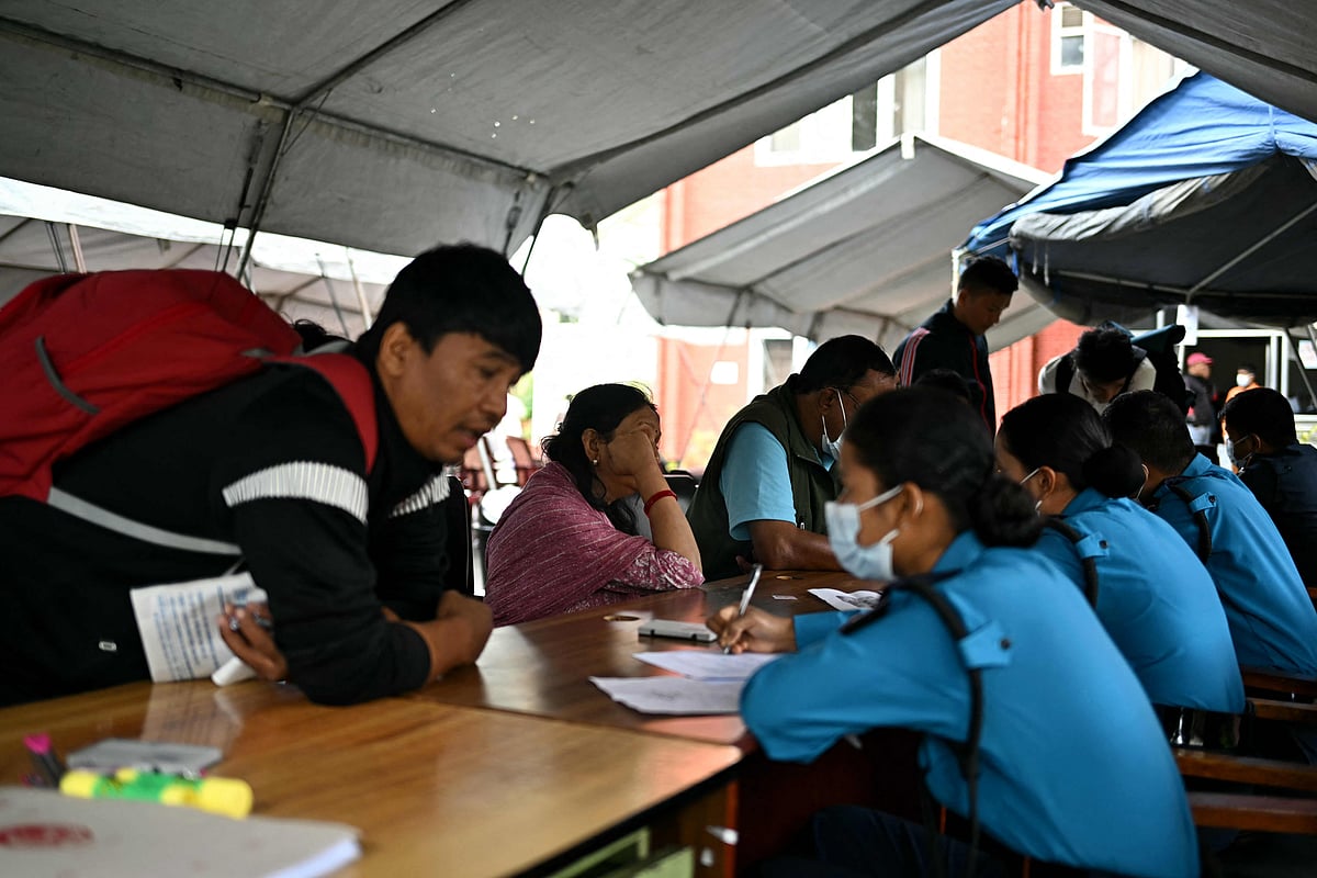 Family members register their information with police personnel to give blood samples for DNA testing to help identify their missing relatives after flash floods, at the Nepal Police Hospital in Kathmandu on 3 September, 2026.