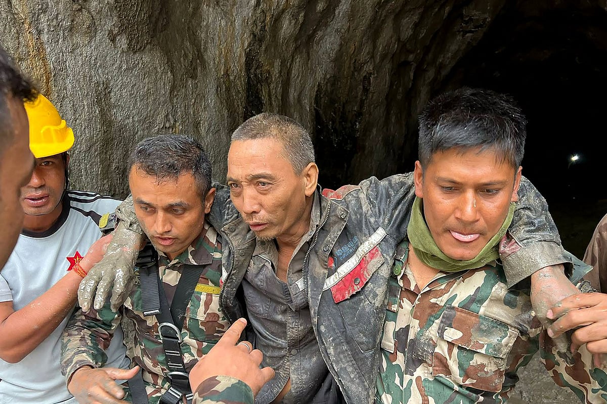 This handout photograph taken and released on 5 September, 2026 via the Facebook page of Nepal Army shows security personnel carrying a Chinese national (2R) rescued from the Audit Tunnel 4 of the Upper Trishuli-1 Hydropower Project site in Nepal's Rasuwa district.