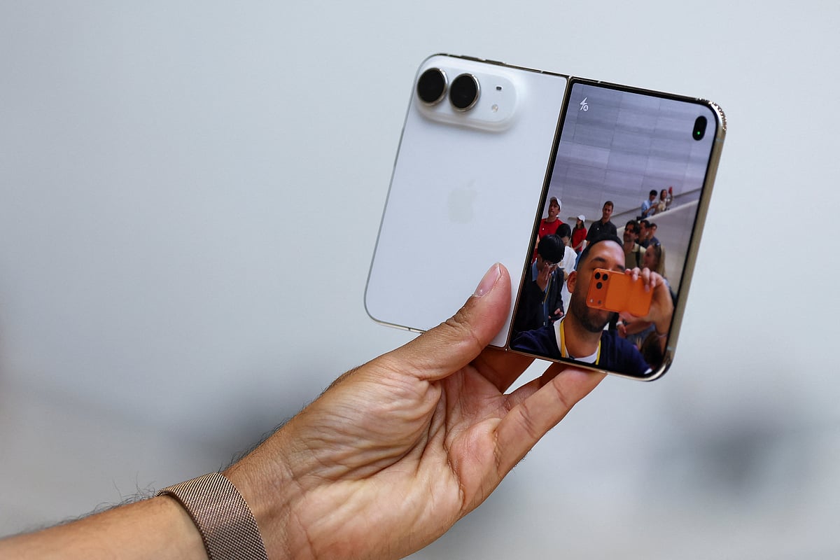 A person holds the new foldable iPhone Duo during Apple's event at the Steve Jobs Theater in Cupertino, California, US 9 September, 2026.