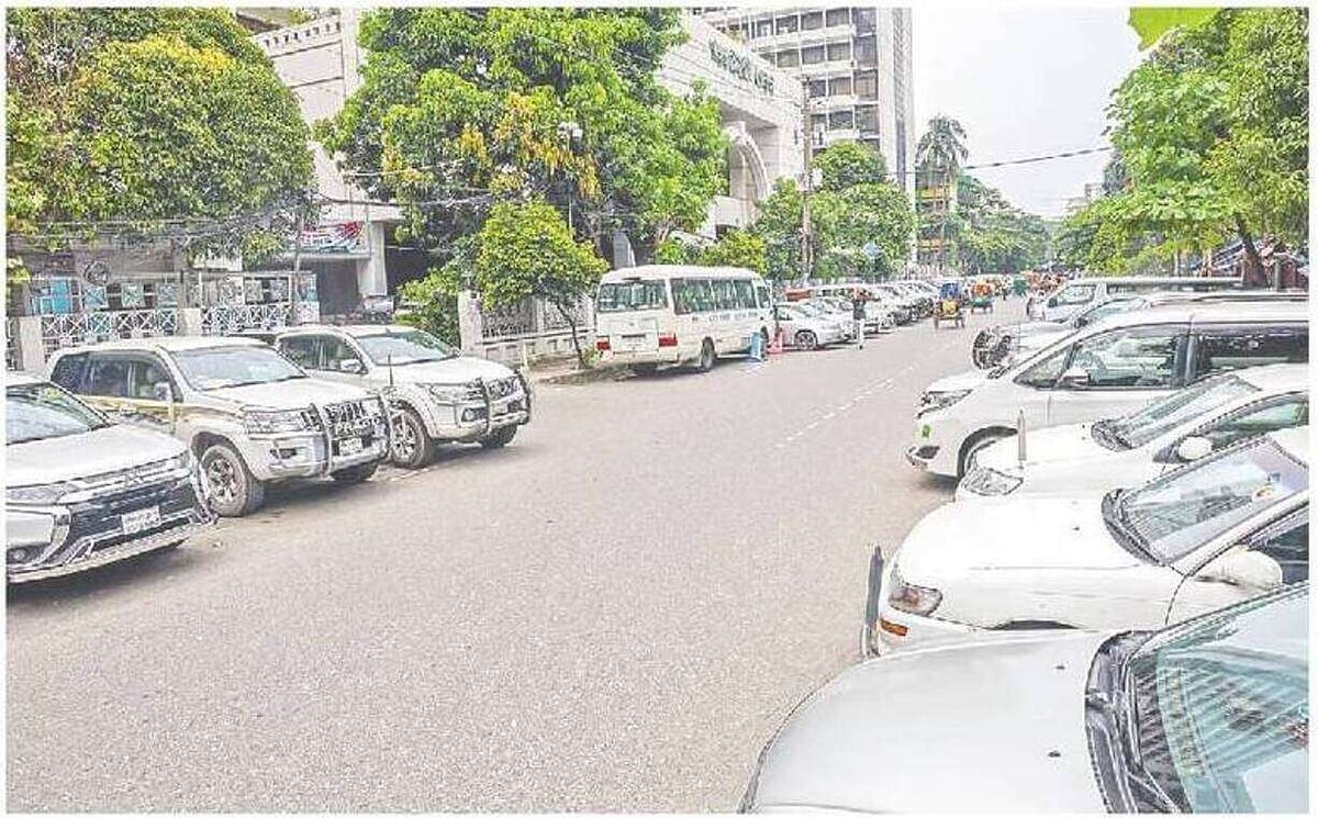 Project vehicles belonging to the Local Government Engineering Department (LGED) have been parked on both sides of the road. The photo was taken on 6 September 2026 in front of the LGED office in Agargaon, Dhaka.