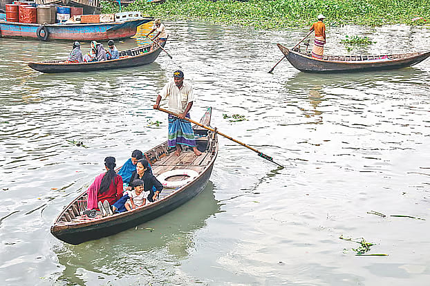 Despite three bridges over the Buriganga River, people still prefer boats for crossing. The photo was taken recently, near Babubazar at Sadarghat.