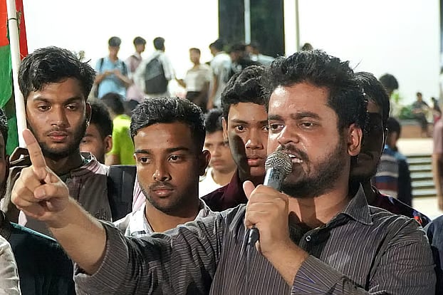 Rajshahi city unit Islami Chhatra Shibir president Imran Nazir speaks at a rally held after a protest procession in the area of the Rajshahi Central Shaheed Minar on Tuesday evening.