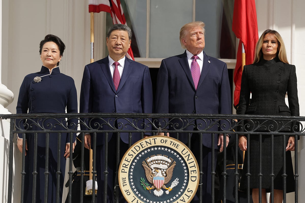 US President Donald Trump, first lady Melania Trump, Chinese President Xi Jinping and his wife, Peng Liyuan watch a military demonstration from a balcony of the White House in Washington, DC, US, 24 September, 2026.