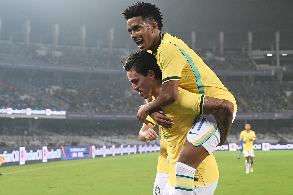 Brazil's forward #19 Pedro (L) celebrates with teammate Brazil's forward #11 Estevao Willian (R) after scoring a goal during the international friendly football match between India and Brazil at the Salt Lake Stadium in Kolkata on 3 October, 2026.
