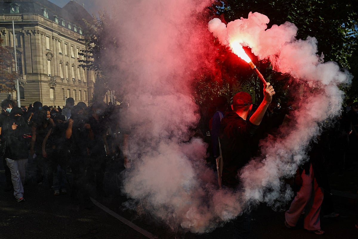 A demonstrator swings a flare as French high school and university students attend a demonstration in Strasbourg as part of a nationwide day of protests and blockades, voicing anger over overcrowded classrooms, teacher shortages and dilapidated school buildings, which students blame on years of underinvestment, France, 6 October 2026.