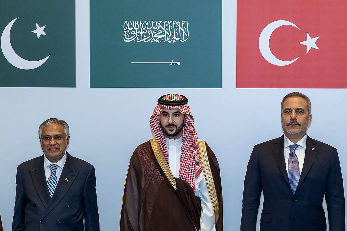 This handout photograph taken and released by the Turkish Foreign Ministry on October 5, 2026 shows (L-R) Pakistans Deputy Prime Minister and Minister for Foreign Affairs Ishaq Dar, Saudi Defence Minister Prince Khalid bin Salman Al Saud and Turkish Foreign Minister Hakan Fidan posing during a meeting of the Strategic Political and Defense Committee, established under the Mecca Joint Defense Agreement, in Riyadh.
