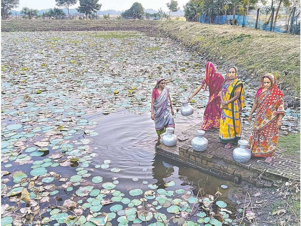 Women collect drinking water from a pond due to severe crisis of potable water in Koyra Upazila of Khulna. The photo is taken from Noyani village in the upazila on 30 September 2026