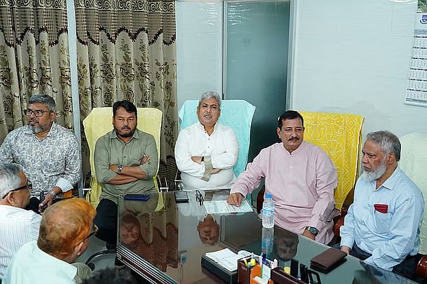 Land Minister Mizanur Rahman takes Rajshahi Medical University Vice-Chancellor Professor Jawadul Haque to the VC's temporary office on the night of 8 October 2026.