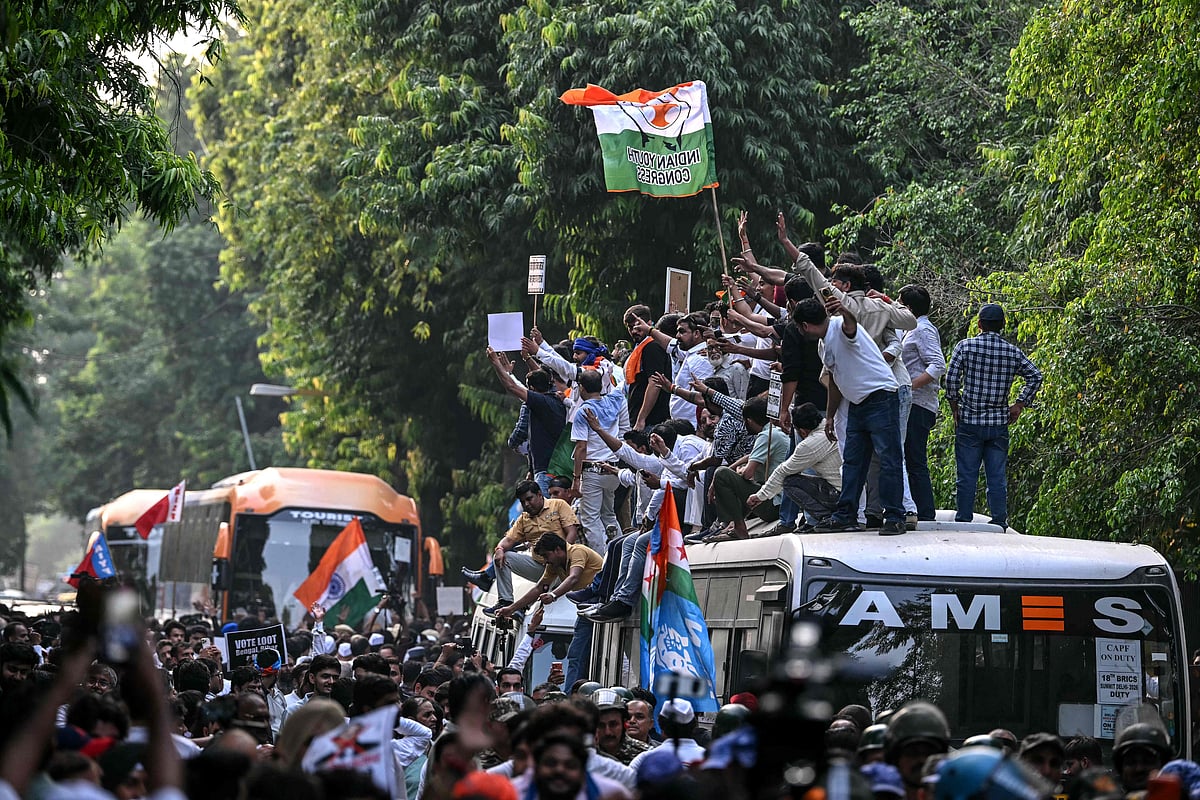 Congress party supporters shout slogans as India's opposition alliance, the INDIA bloc (Indian National Developmental Inclusive Alliance), leaders protest in New Delhi on October 8, 2026 against the country's Chief Election Commissioner Gyanesh Kumar calling for his resignation over alleged irregularities in the Special Intensive Revision (SIR) of electoral rolls. (Photo by Arun SANKAR / AFP)
