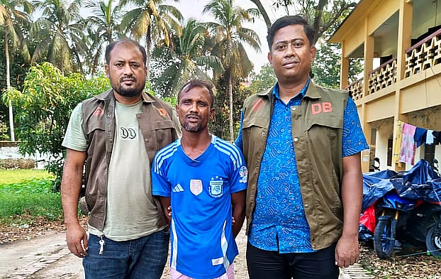 Sumon Mia, the CNG-run auto-rickshaw driver arrested in the case over the schoolgirl’s murder in Lalmai, Cumilla, stands in front of the superintendent of police’s office on 11 October, 2026.