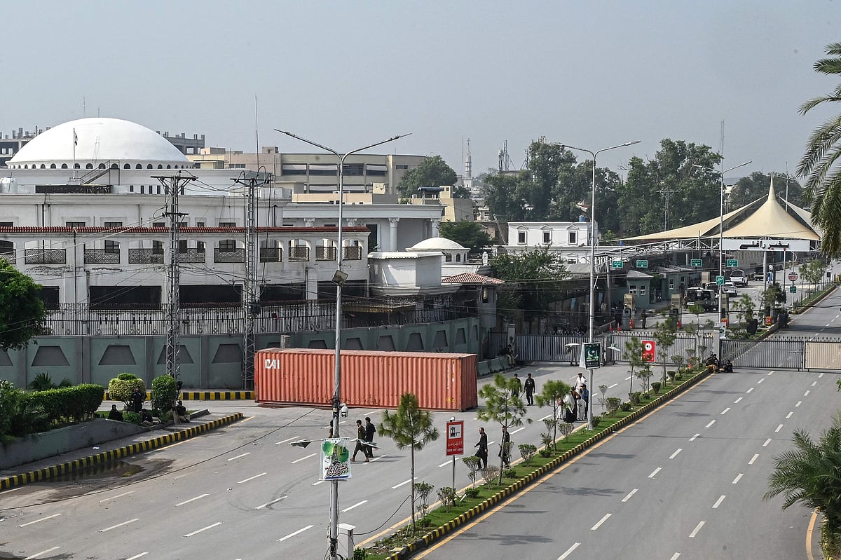 A general view shows a blocked road near the provincial assembly building (L, back) amid ongoing protests by the opposition Pakistan Tehreek-e-Insaf (PTI) party demanding the release of jailed former prime minister Imran Khan in Peshawar on 11 October 2026.