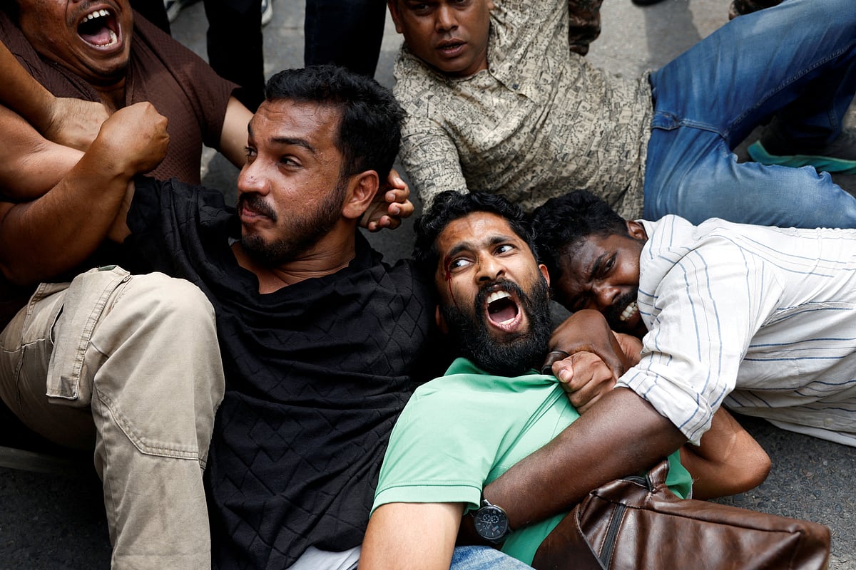Protesters react as they are detained by security personnel during a protest by the Cockroach Janta Party (CJP) seeking the resignation of India's Chief Election Commissioner Gyanesh Kumar, near the protest site in New Delhi, India, October 11, 2026. REUTERS/Adnan Abidi     TPX IMAGES OF THE DAY
