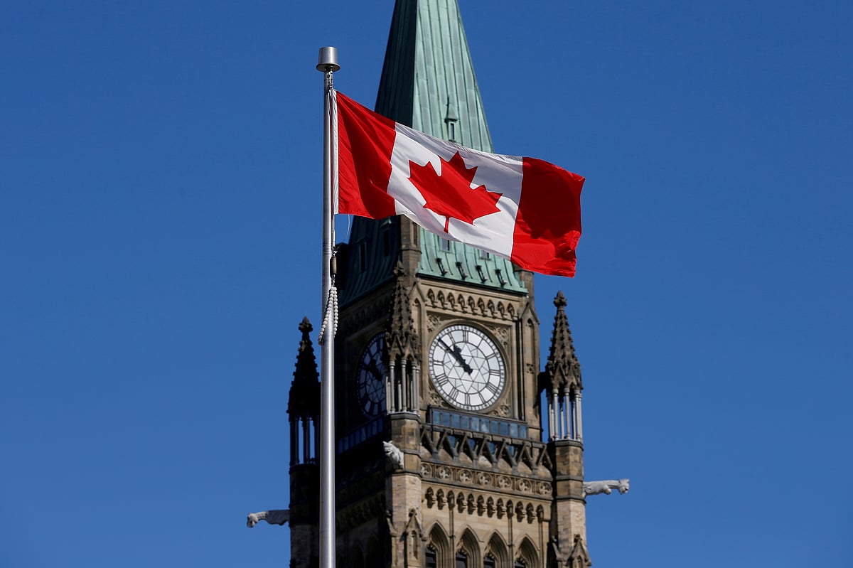 A Canadian flag flies in front of the Peace Tower on Parliament Hill in Ottawa on 22 March 2017.